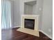 Living room with a fireplace and wood-look flooring at 7315 Fig Ln, Charlotte, NC 28215