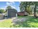 Backyard featuring a large shed, grassy area, and a wooden deck area at 816 Radio Rd, Statesville, NC 28677