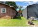 Spacious backyard featuring a shed, patio, and grill, perfect for outdoor entertaining at 816 Radio Rd, Statesville, NC 28677