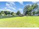 Large backyard featuring a green fence, shed, and lots of space at 816 Radio Rd, Statesville, NC 28677