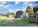 Backyard featuring a large shed, grassy area, and a wooden deck area at 816 Radio Rd, Statesville, NC 28677
