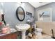 Charming bathroom with updated fixtures, classic pedestal sink, and decorative tiling at 816 Radio Rd, Statesville, NC 28677