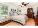 Comfortable bedroom with hardwood floors, a ceiling fan, and ample natural light at 816 Radio Rd, Statesville, NC 28677