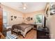 Neutral bedroom featuring wood-look flooring and a ceiling fan for comfort at 816 Radio Rd, Statesville, NC 28677