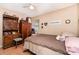 Cozy bedroom showcasing a bed with neutral linens and rustic wooden furniture at 816 Radio Rd, Statesville, NC 28677