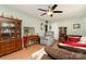 Inviting living room featuring laminate floors, neutral green walls, and comfortable furnishings at 816 Radio Rd, Statesville, NC 28677