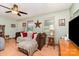 Bright living room with ceiling fan, laminate floors, comfortable couches, and natural light at 816 Radio Rd, Statesville, NC 28677