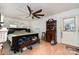 Bright main bedroom with ceiling fan and neutral walls; includes a vintage secretary desk at 816 Radio Rd, Statesville, NC 28677