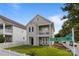 Charming two-story home with double balconies near a street sign for Grier Springs in a beautiful neighborhood at 9704 Grier Springs Ln, Charlotte, NC 28213