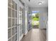 Hallway with beautiful double glass doors leading to the outside at 9704 Grier Springs Ln, Charlotte, NC 28213