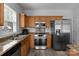 Galley kitchen features stainless appliances, and granite countertops at 9704 Grier Springs Ln, Charlotte, NC 28213
