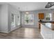 Bright eat-in kitchen area features wood floors, stainless appliances, and lots of natural light at 9704 Grier Springs Ln, Charlotte, NC 28213