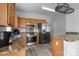 Kitchen features stainless steel appliances, wood cabinets, and granite countertops at 9704 Grier Springs Ln, Charlotte, NC 28213