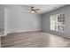 Bright living room with hardwood floors and ample natural light from windows at 9704 Grier Springs Ln, Charlotte, NC 28213