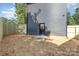 Fenced backyard with a modern black siding, newly laid straw, and a black door at 101 Bryan St, Kannapolis, NC 28083