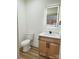 Half bathroom with a granite vanity, framed mirror, and modern fixtures at 101 Bryan St, Kannapolis, NC 28083