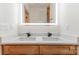 Modern bathroom with double sink vanity featuring a marble countertop and a large lighted mirror at 101 Bryan St, Kannapolis, NC 28083