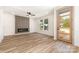 Spacious living room with wood floors, a modern fireplace, and a view to the yard at 101 Bryan St, Kannapolis, NC 28083
