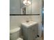Classic bathroom with tiled walls, black and white tile floors, and a vanity at 1017 Andover Rd, Charlotte, NC 28211