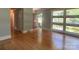 Open living area with gleaming hardwood floors and abundant natural light from large windows at 1017 Andover Rd, Charlotte, NC 28211