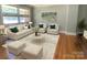 Bright living room featuring neutral furniture, hardwood floors, and ample natural light at 1017 Andover Rd, Charlotte, NC 28211