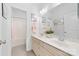 Well-lit bathroom with double sinks, a large mirror, and a shower-tub combination at 10320 Lemington Dr, Mint Hill, NC 28227
