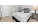 Bright bedroom showcasing a comfortable bed with a decorative headboard and fresh, white linens at 10320 Lemington Dr, Mint Hill, NC 28227