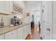 Convenient butler's pantry with a wine rack and coffee station with granite countertops at 10320 Lemington Dr, Mint Hill, NC 28227