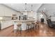 Bright, airy kitchen with a large island, pendant lighting, and stainless steel appliances at 10320 Lemington Dr, Mint Hill, NC 28227