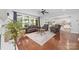 Spacious living room featuring hardwood floors and a large window with backyard views at 10320 Lemington Dr, Mint Hill, NC 28227