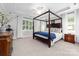 Spacious primary bedroom boasts trey ceilings, natural light, and a sitting area for ultimate comfort at 10320 Lemington Dr, Mint Hill, NC 28227