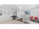 Spacious room featuring a TV, musical instruments, and bright windows at 10320 Lemington Dr, Mint Hill, NC 28227