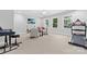 Spacious room featuring a TV, musical instruments, workout equipment, and bright windows at 10320 Lemington Dr, Mint Hill, NC 28227