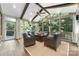 Relaxing sunroom with natural light, comfortable seating, and views of the outdoors at 10320 Lemington Dr, Mint Hill, NC 28227