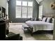 Cozy bedroom featuring carpet, a large bright window, and comfortable furniture at 104 Bunker Way, Mooresville, NC 28117