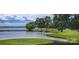 Picturesque golf course view with lake and lush green landscape at 104 Bunker Way, Mooresville, NC 28117