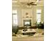 Inviting living room with fireplace, coffered ceilings, and large windows at 104 Bunker Way, Mooresville, NC 28117