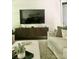 Comfortable living room featuring modern decor, stylish furniture, and entertainment center at 104 Bunker Way, Mooresville, NC 28117