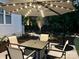 Outdoor patio with elegant seating and a lighted umbrella for nighttime ambiance at 104 Bunker Way, Mooresville, NC 28117