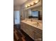 Well-lit bathroom with a double vanity and a large mirror at 10607 Old Bridge Ln, Charlotte, NC 28269