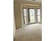 Cozy bedroom featuring a large bay window and plush carpeting at 10607 Old Bridge Ln, Charlotte, NC 28269