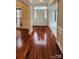 Bright foyer with gleaming hardwood floors and detailed white molding at 10607 Old Bridge Ln, Charlotte, NC 28269