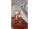 Bright open-concept layout with wood floors and view of the kitchen and staircase at 10607 Old Bridge Ln, Charlotte, NC 28269