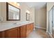 Bathroom featuring double vanity with framed mirrors and a tile floor at 1103 Phar Lap Dr, Indian Trail, NC 28079