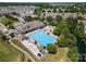 Overhead view of the neighborhood pool area with lounge chairs, umbrellas, and lush landscaping at 1103 Phar Lap Dr, Indian Trail, NC 28079