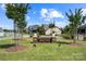 Landscaped entrance to a neighborhood, featuring brick signage with the community name and mature trees at 1103 Phar Lap Dr, Indian Trail, NC 28079