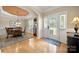 Home entryway featuring a leaded glass front door, wainscoting and view to the dining room at 1103 Phar Lap Dr, Indian Trail, NC 28079