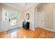 Charming entryway with hardwood floors, decorative door and a stylish console table at 1103 Phar Lap Dr, Indian Trail, NC 28079