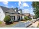 Charming home with white picket fence, manicured landscaping, and inviting front porch at 1103 Phar Lap Dr, Indian Trail, NC 28079