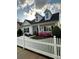 Inviting exterior of a home featuring a charming porch and well-manicured landscaping at 1103 Phar Lap Dr, Indian Trail, NC 28079
